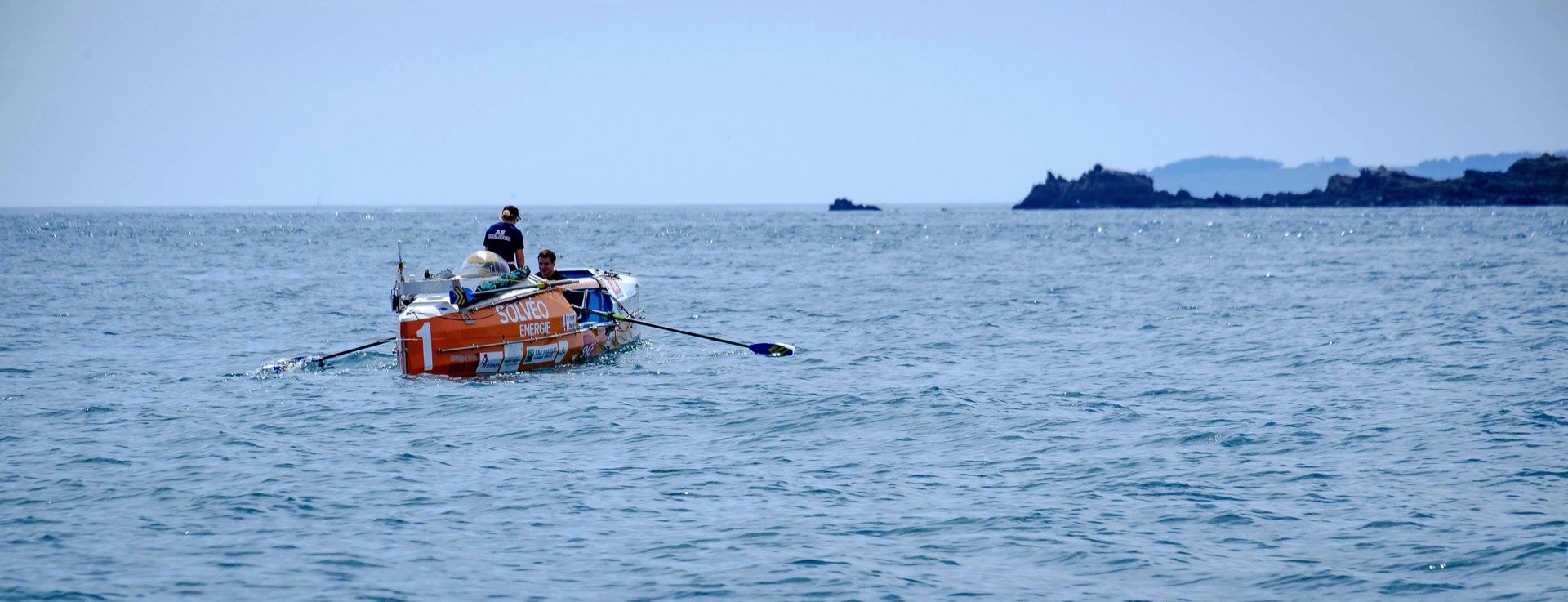 Photo de 2 rameurs sur l'eau